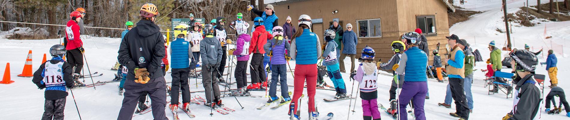 Kids at the bottom of the rope tow at Ski Hill